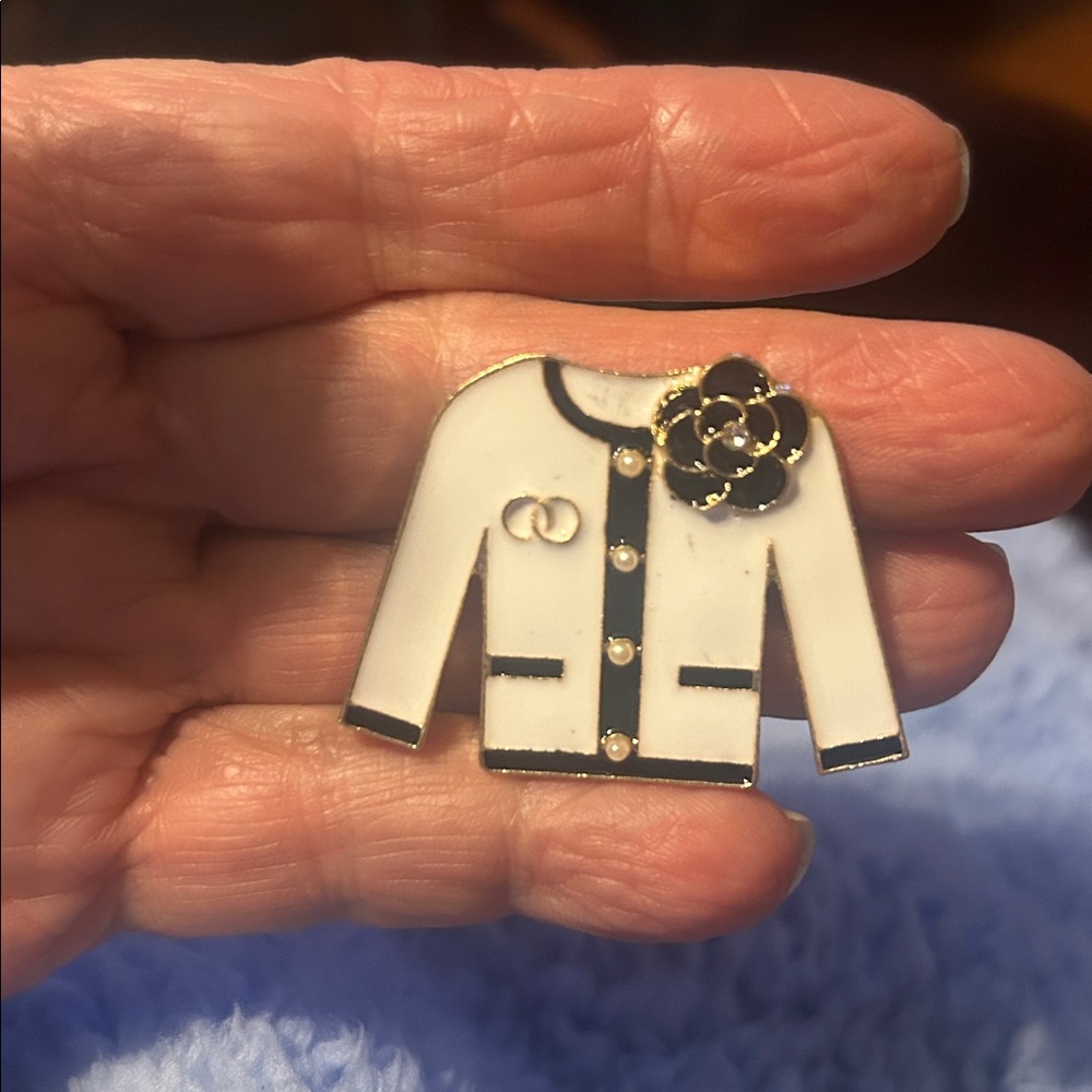 White enamel jacket  brooch